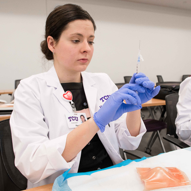 A nursing student in wound care class