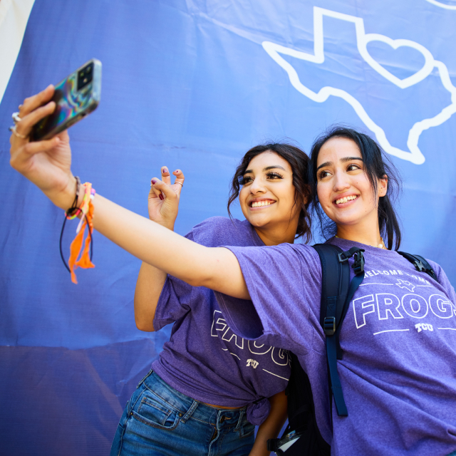 Two girls taking a photo together