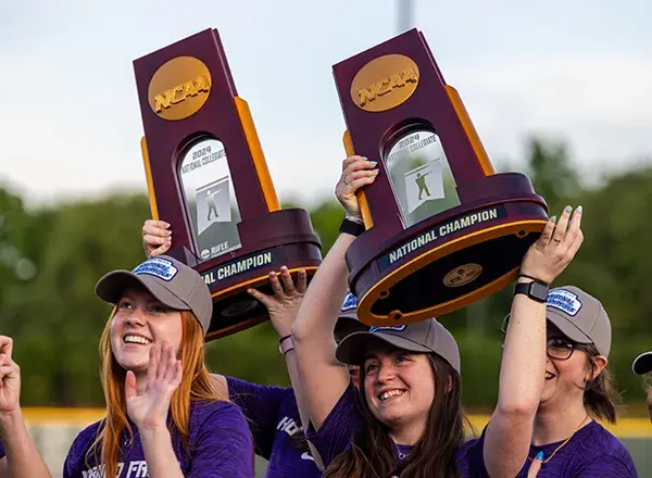 TCU Rifle team holds up their NCAA championship trophies