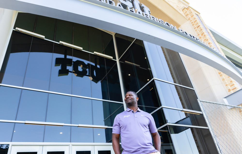 LT in front of Mike & Brenda Harrison Football Performance Center